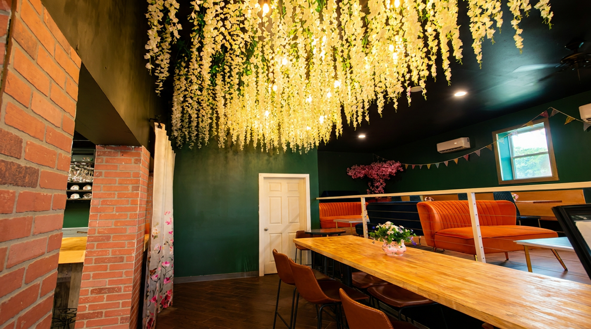 Hanging flowers, orange booths, warm light